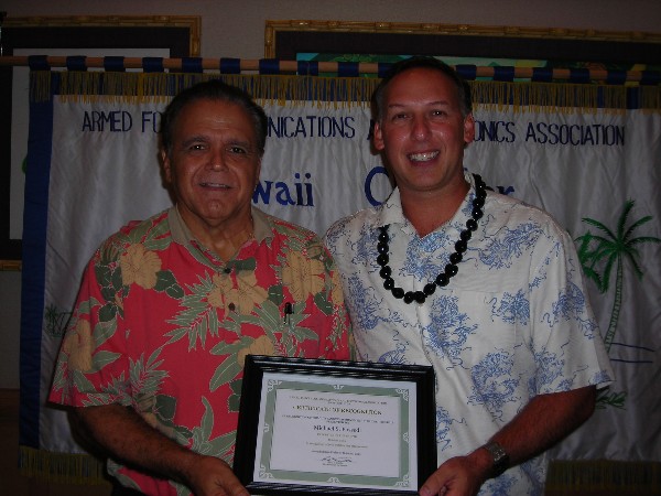 In October, Lindo (l) recognizes the Executive of the Month, Michael Possedi, senior account manager, EMC Corporation.